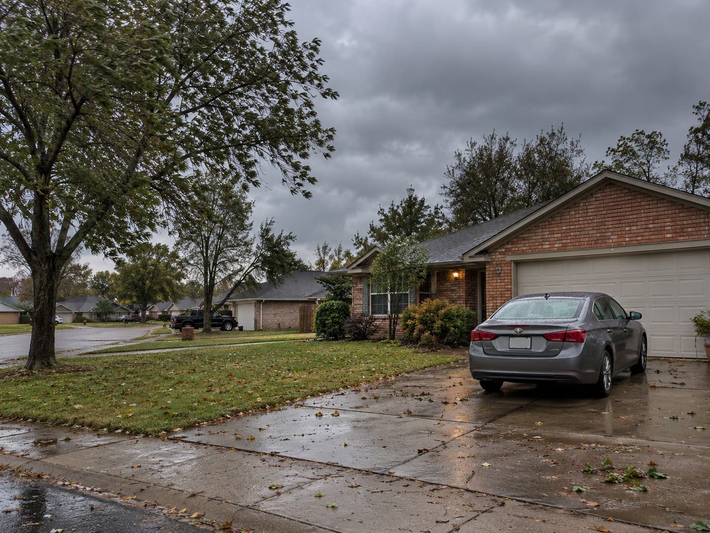 Car parked outside an Oklahoma home during stormy weather